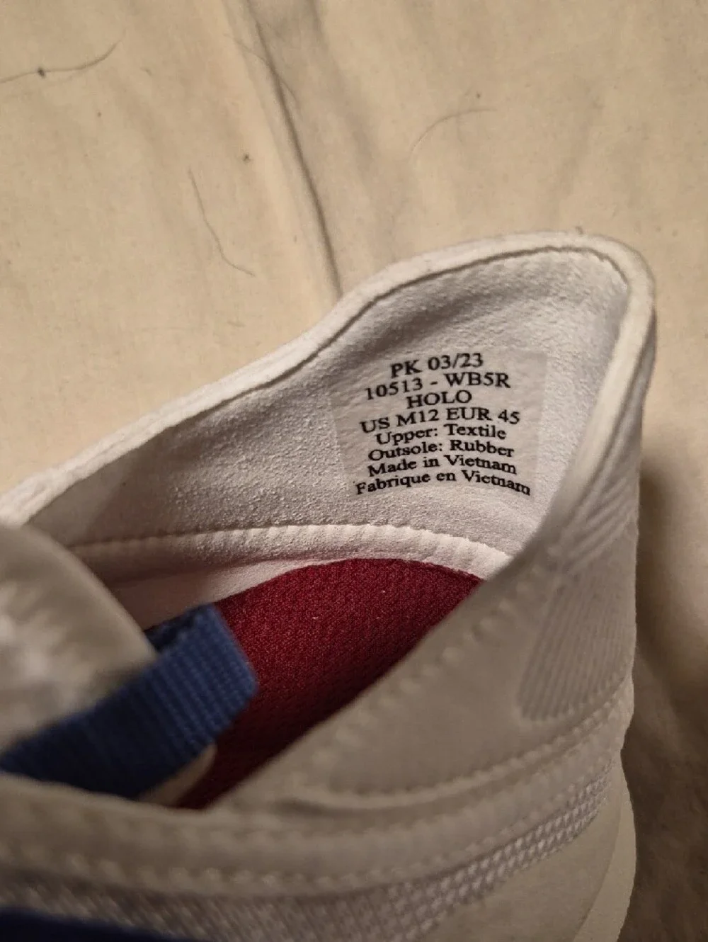 OluKai White Sneakers with Blue Webbing Accents
